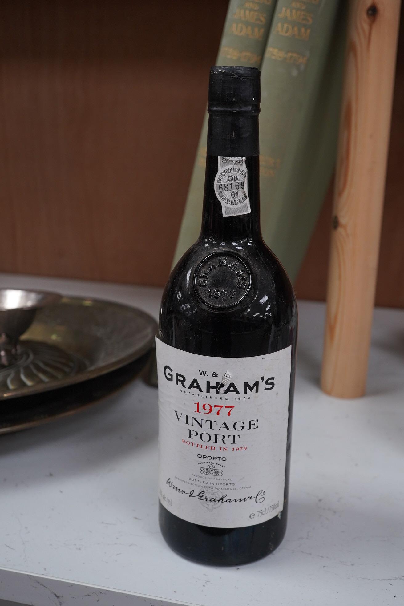 Twelve bottles of various Ports, Madeiras and Sherry, including a bottle of Graham’s vintage Port 1977. Condition - storage unknown